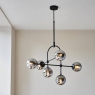 Matt Blak Multi Arm Pendant with Grey Tinted Glass. 