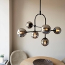 Matt Blak Multi Arm Pendant with Grey Tinted Glass. 