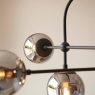 Matt Blak Multi Arm Pendant with Grey Tinted Glass. 