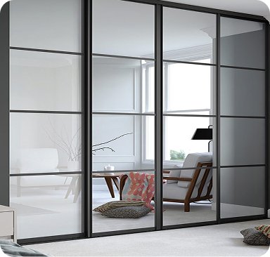 Made to measure wardrobe with black-framed glazed sliding doors